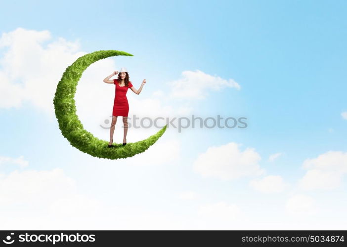 Woman in red. Young woman in red dress walking on moon