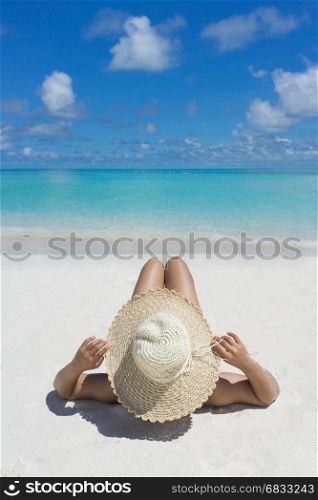 Woman in relaxation on tropical beach in holiday