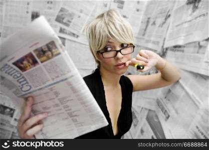 woman in room with newspaper wallpaper