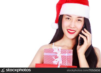 woman in Santa Claus clothes calling on mobile phone with gift box isolated on a white background