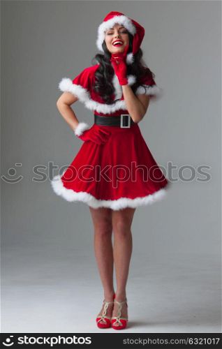 Woman in santa claus costume. Beautiful woman wearing santa claus costume, full length portrait