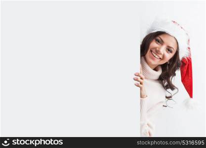 Woman in Santa hat. Woman in Santa hat with blank banner with white copyspace