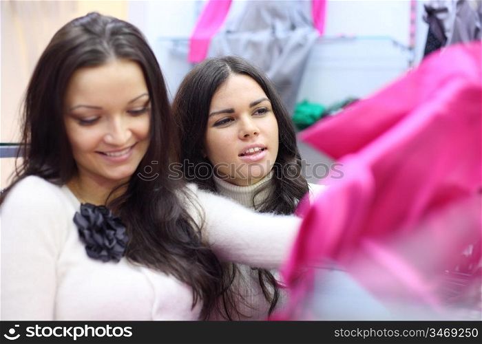 woman in shop look at clothes