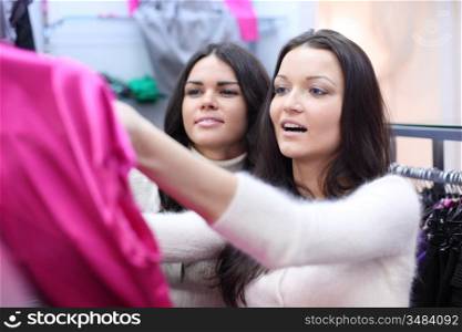 woman in shop look at clothes