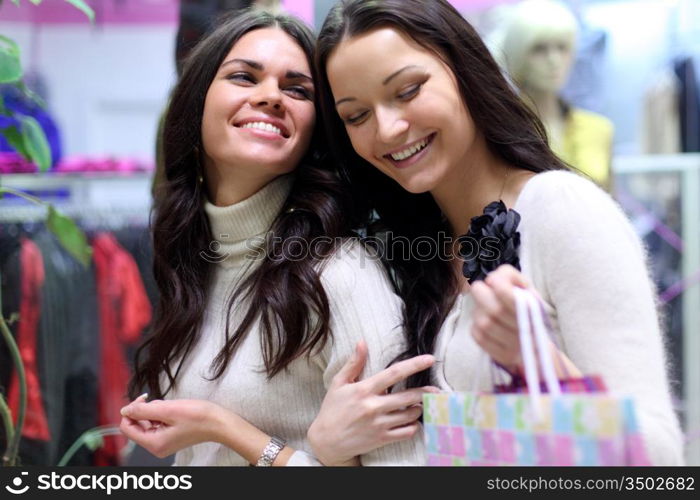 woman in shop look at clothes