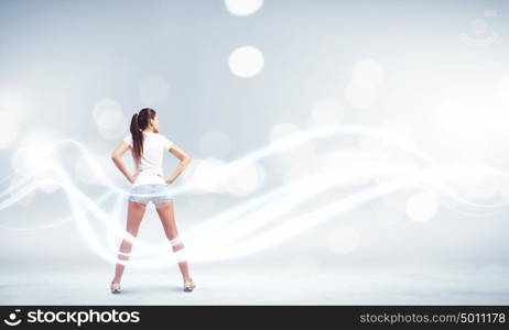 Woman in shorts. Rear view of young woman in shorts and white t-shirt