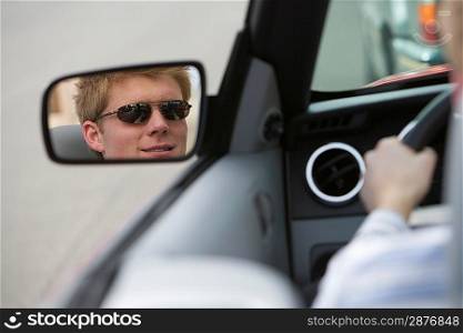 Woman in Side-View Mirror of Car