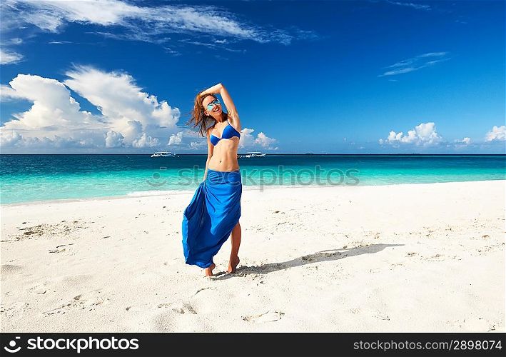 Woman in skirt at tropical beach