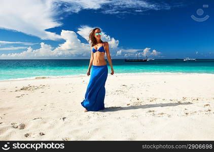 Woman in skirt at tropical beach