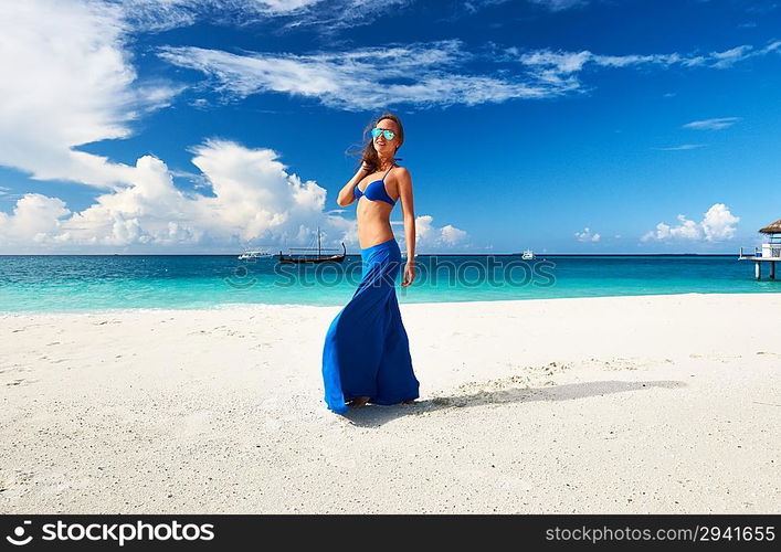 Woman in skirt at tropical beach