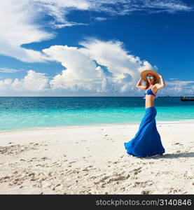 Woman in skirt at tropical beach