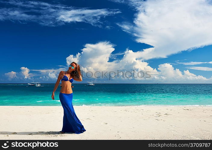 Woman in skirt at tropical beach