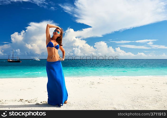 Woman in skirt at tropical beach