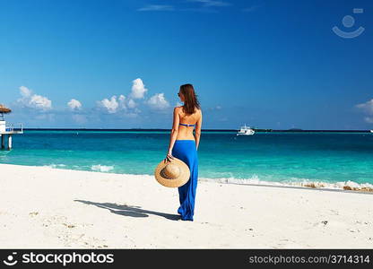 Woman in skirt at tropical beach