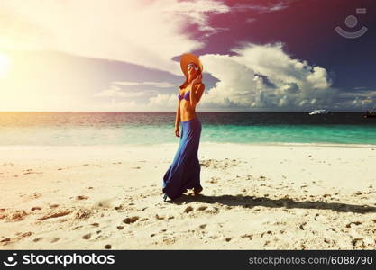 Woman in skirt at tropical beach