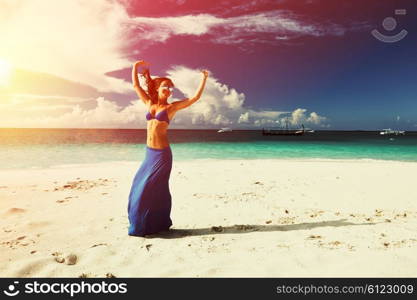 Woman in skirt at tropical beach