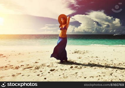 Woman in skirt at tropical beach