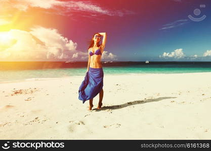 Woman in skirt at tropical beach