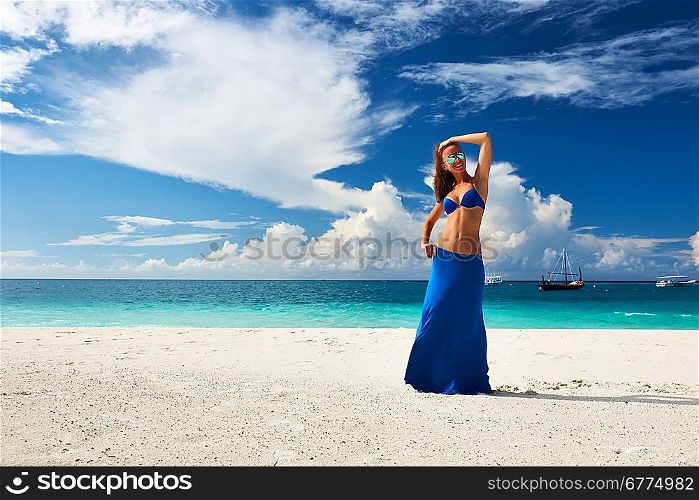 Woman in skirt at tropical beach