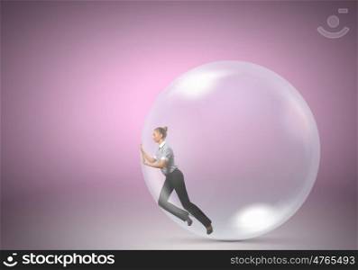 Woman in soap bubble. Young businesswoman trying to get out of soap bubble