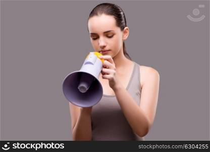 Woman in sports concept with loudspeaker