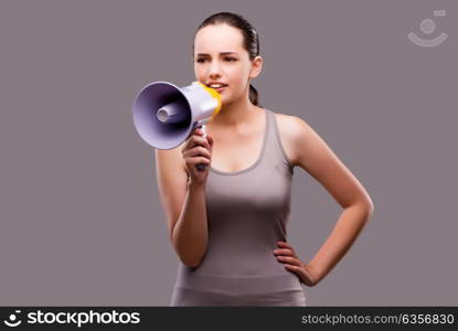 Woman in sports concept with loudspeaker