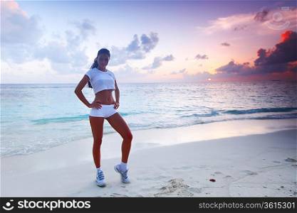 Woman in sportswear on beach