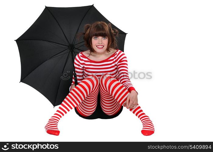 woman in striped clothes holding an umbrella