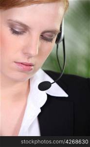 Woman in suit with headset