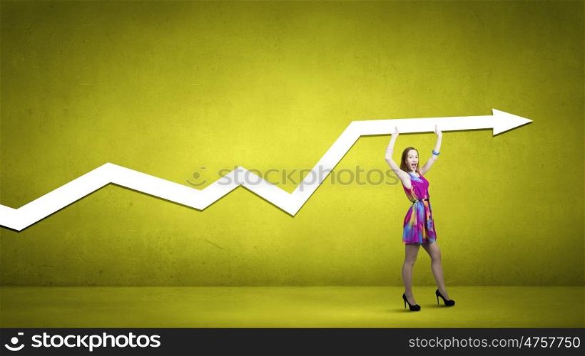 Woman in summer dress. Young girl in multicolored bright dress holding arrow