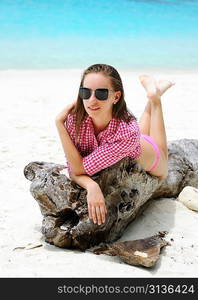 Woman in sunglasses at beach