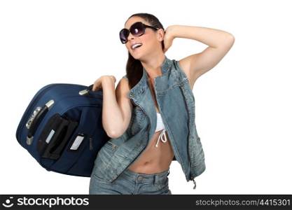 Woman in sunglasses with a suitcase