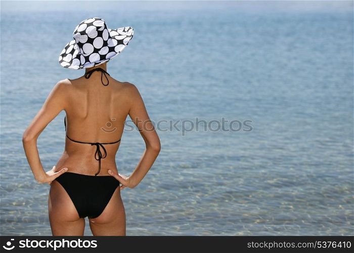 Woman in swimsuit, back view