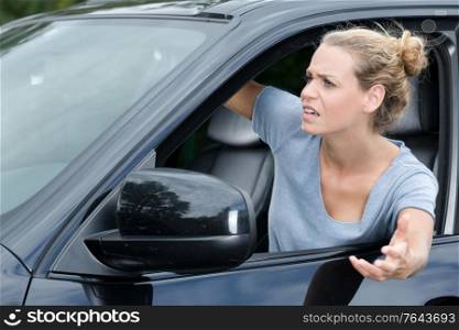 woman in the car annoyed at other drivers