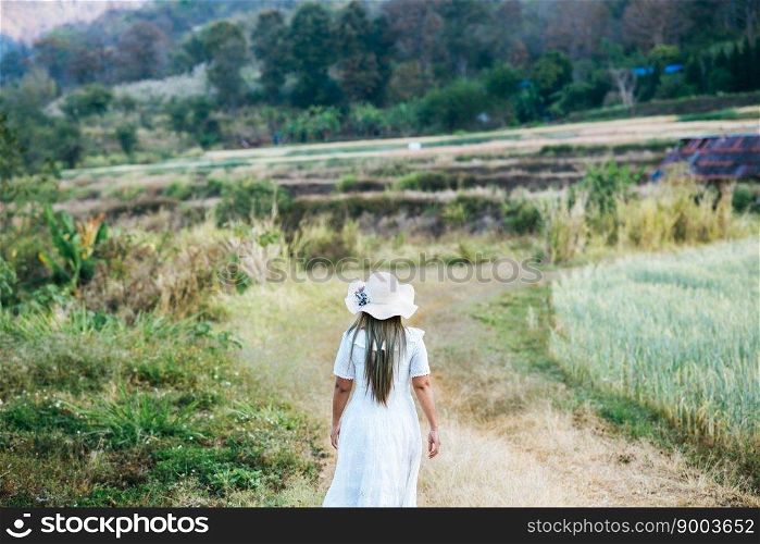 Woman in the hat happiness in the nature