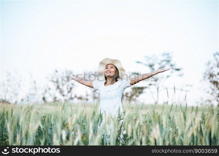 Woman in the hat happiness in the nature