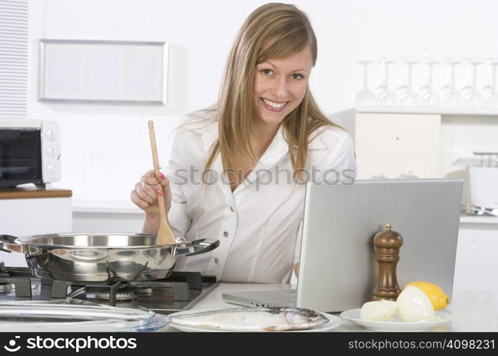 woman in the kitchen with computer