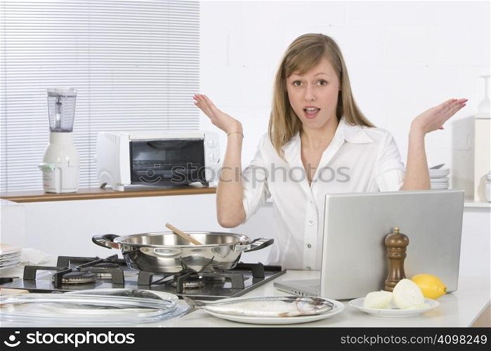 woman in the kitchen with computer