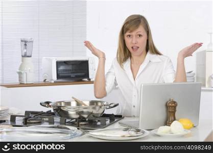 woman in the kitchen with computer