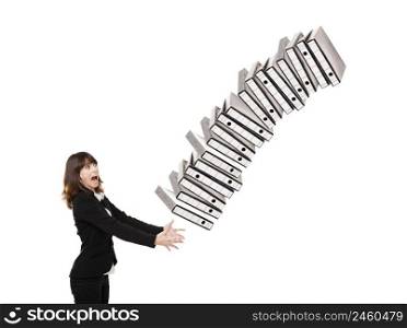 Woman in the office stumbling with a pile of folders in the hands, isolated on white