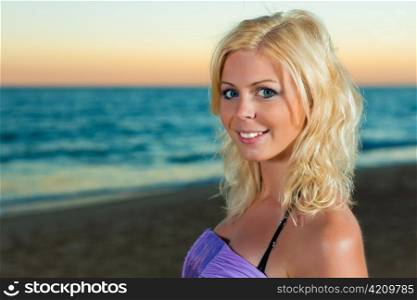 Woman in the sunset, wearing smart casual clothes