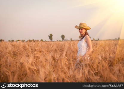 Woman in the wheat field, farmer with crop