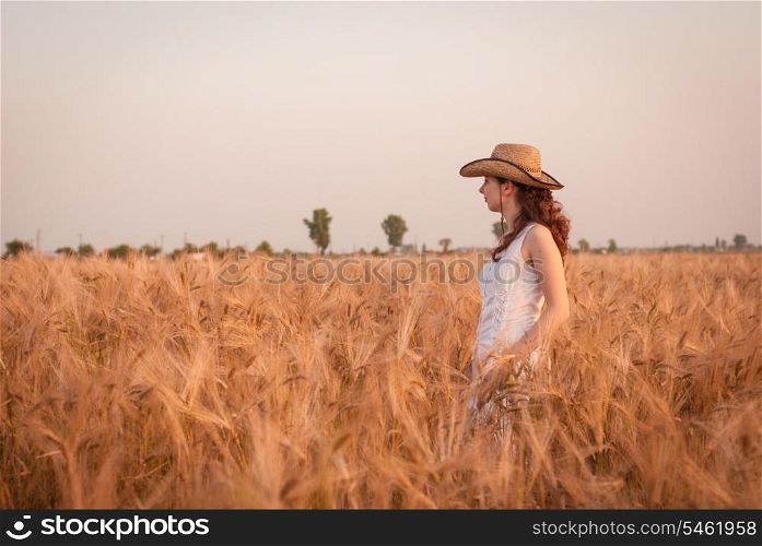 Woman in the wheat field, farmer with crop