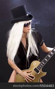 woman in top hat with golden electric guitar and cigarette