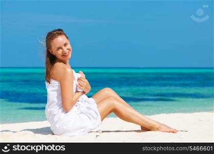Woman in towel at tropical beach