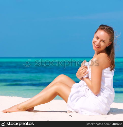 Woman in towel at tropical beach