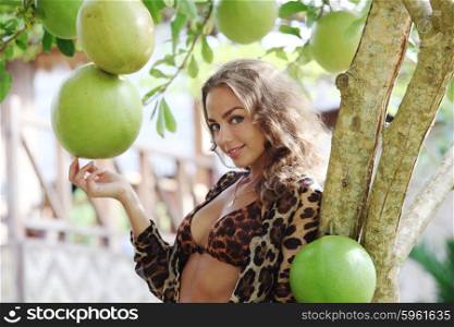 Woman in tropical forest. Beautiful sexy woman posing in tropical forest