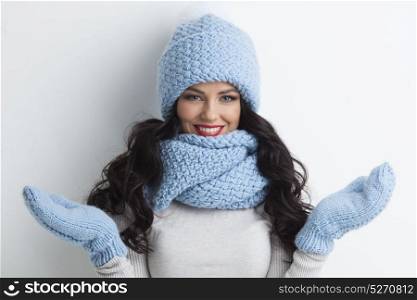 Woman in warm clothing. Beautiful woman in warm hat, mittens and scarf on white background