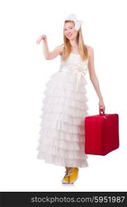 Woman in wedding dress with suitcase
