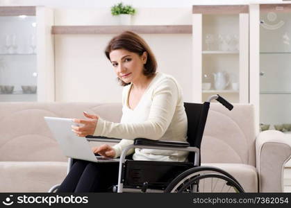 Woman in wheelchair at home 